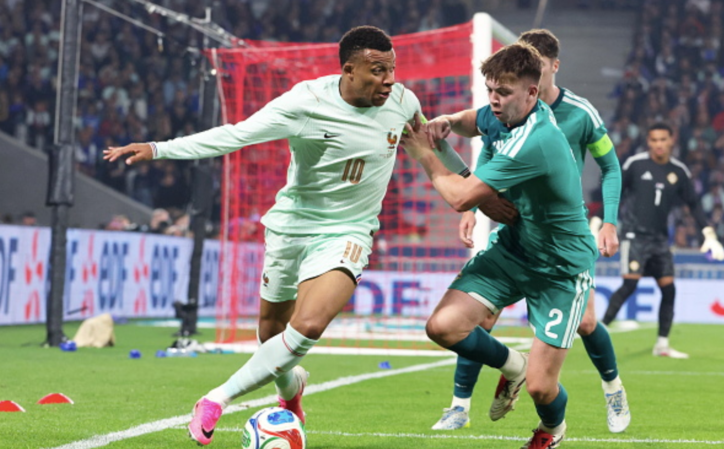 LILLE, FRANCE - JUNE 08: Kylian Mbappe #10 of Team France in action with Patrick Kelly #2 of Northern Ireland during the International Friendly match between France and Northern Ireland at Stade Pierre Mauroy on June 08, 2026 in Lille, France. (Photo by Xavier Laine/Getty Images)