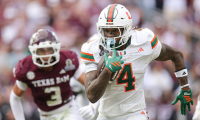 COLLEGE STATION, TEXAS - DECEMBER 20: Mark Fletcher Jr. #4 of the Miami Hurricanes runs the ball against the Texas A&M Aggies during the 2025 College Football Playoff First Round Game at Kyle Field on December 20, 2025 in College Station, Texas. (Photo by Alex Slitz/Getty Images)