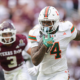 COLLEGE STATION, TEXAS - DECEMBER 20: Mark Fletcher Jr. #4 of the Miami Hurricanes runs the ball against the Texas A&M Aggies during the 2025 College Football Playoff First Round Game at Kyle Field on December 20, 2025 in College Station, Texas. (Photo by Alex Slitz/Getty Images)
