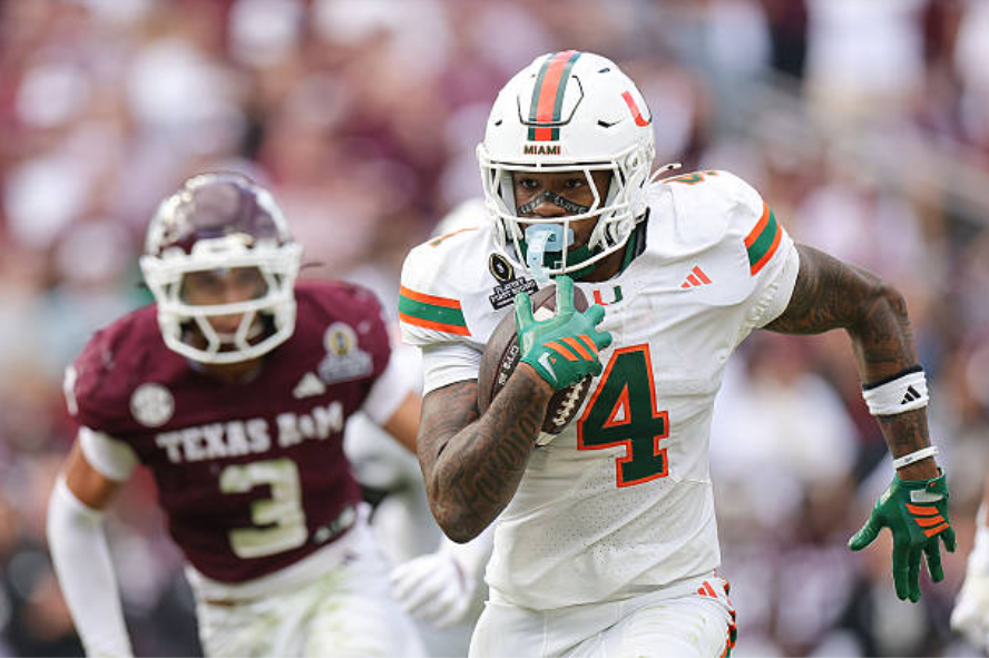 COLLEGE STATION, TEXAS - DECEMBER 20: Mark Fletcher Jr. #4 of the Miami Hurricanes runs the ball against the Texas A&M Aggies during the 2025 College Football Playoff First Round Game at Kyle Field on December 20, 2025 in College Station, Texas. (Photo by Alex Slitz/Getty Images)