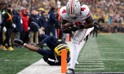 ANN ARBOR, MICHIGAN - NOVEMBER 29: Jeremiah Smith #4 of the Ohio State Buckeyes scores a touchdown against the Michigan Wolverines at Michigan Stadium on November 29, 2025 in Ann Arbor, Michigan. (Photo by Luke Hales/Getty Images)