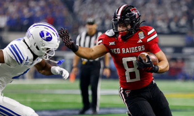 ARLINGTON, TEXAS - DECEMBER 6: Cameron Dickey #8 of the Texas Tech Red Raiders carries the ball as Mory Bamba #4 of the BYU Cougars pursues during the first half of the Big 12 Championship at AT&T Stadium on December 6, 2025 in Arlington, Texas. (Photo by Ron Jenkins/Getty Images)