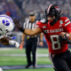 ARLINGTON, TEXAS - DECEMBER 6: Cameron Dickey #8 of the Texas Tech Red Raiders carries the ball as Mory Bamba #4 of the BYU Cougars pursues during the first half of the Big 12 Championship at AT&T Stadium on December 6, 2025 in Arlington, Texas. (Photo by Ron Jenkins/Getty Images)