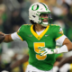 EUGENE, OREGON - NOVEMBER 14: Dante Moore #5 of the Oregon Ducks looks to throw during the first half against the Minnesota Golden Gophers at Autzen Stadium on November 14, 2025 in Eugene, Oregon. (Photo by Soobum Im/Getty Images)