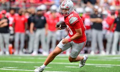 COLUMBUS, OHIO - SEPTEMBER 05: Julian Sayin #10 of the Ohio State Buckeyes carries the ball to score a three-yard touchdown during the second quarter against the Ball State Cardinals at Ohio Stadium on September 05, 2026 in Columbus, Ohio. (Photo by Nick Cammett/Getty Images)