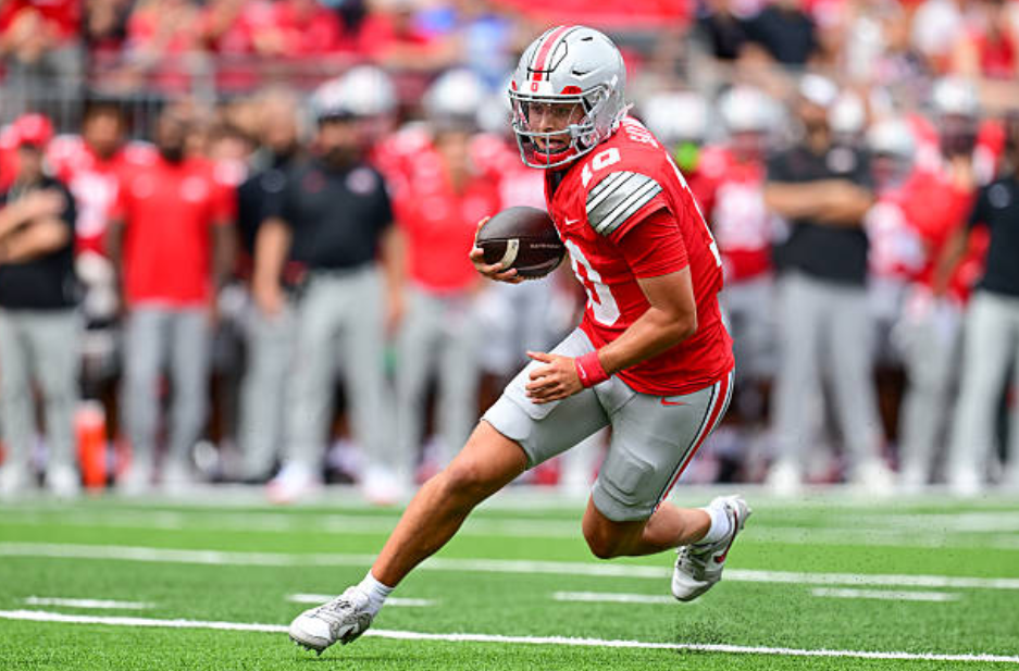 COLUMBUS, OHIO - SEPTEMBER 05: Julian Sayin #10 of the Ohio State Buckeyes carries the ball to score a three-yard touchdown during the second quarter against the Ball State Cardinals at Ohio Stadium on September 05, 2026 in Columbus, Ohio. (Photo by Nick Cammett/Getty Images)